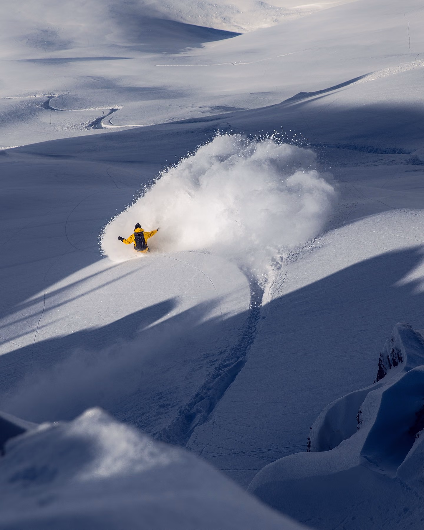 Skier turning through deep powder in Gulmarg