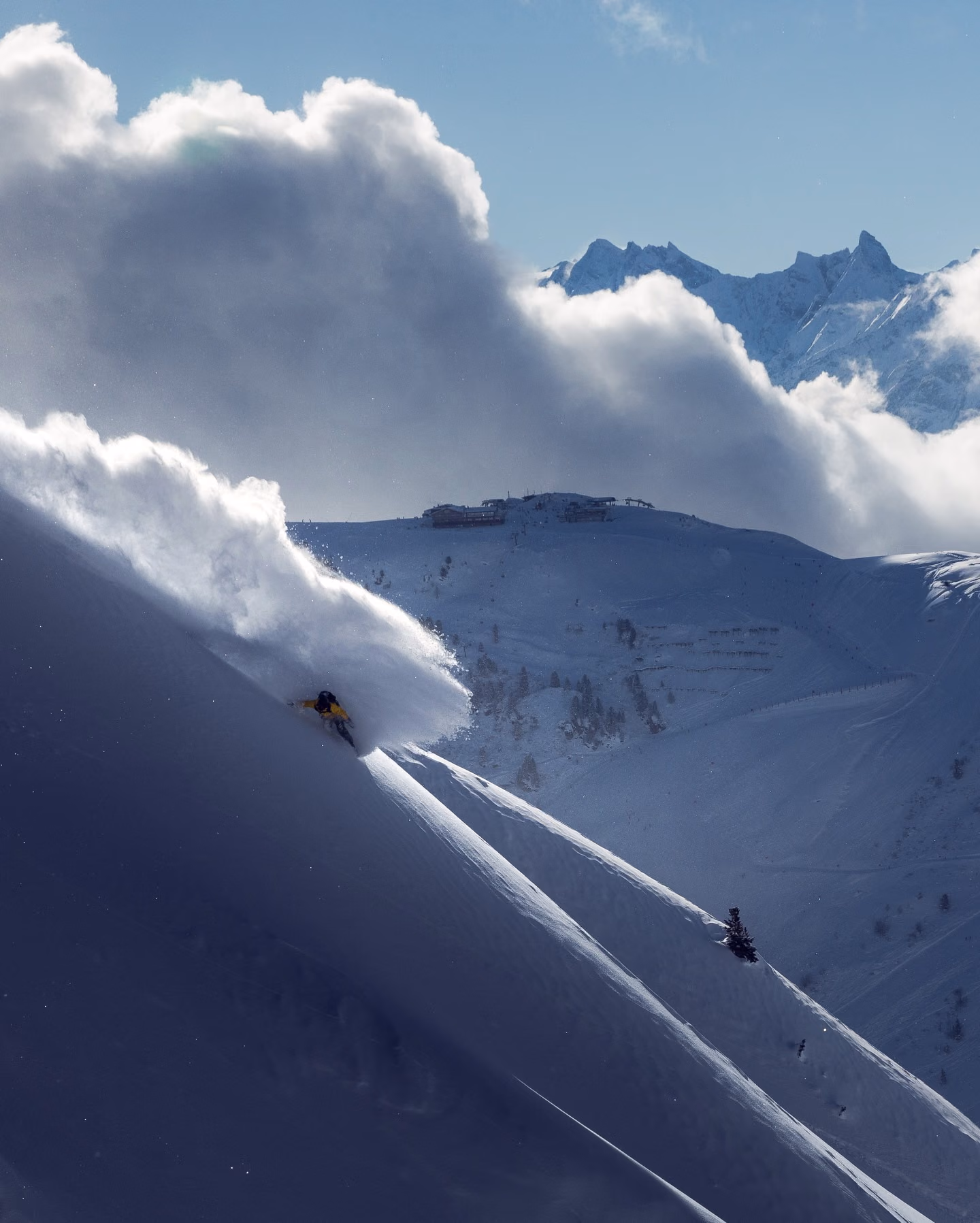 Skier making a deep powder turn in Gulmarg
