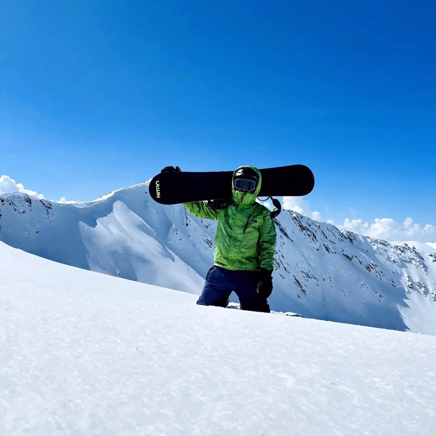 Snowboarder on a ridge line above Gulmarg